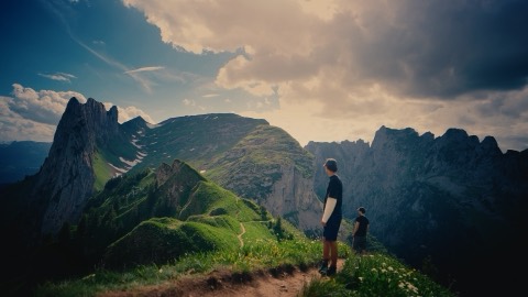 Ridge path under heavy clouds, graded with the Alpine Gold LUT